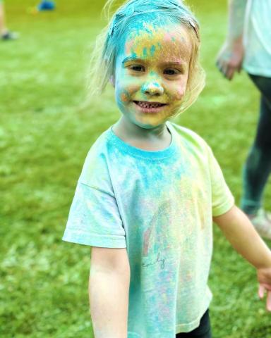 child covered in paint