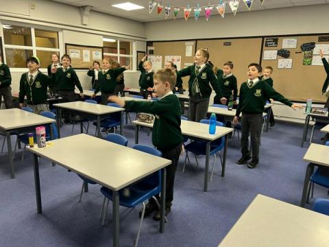 children doing an activity in the classroom at school