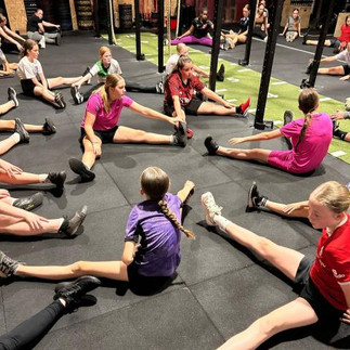 teenage girls stretching