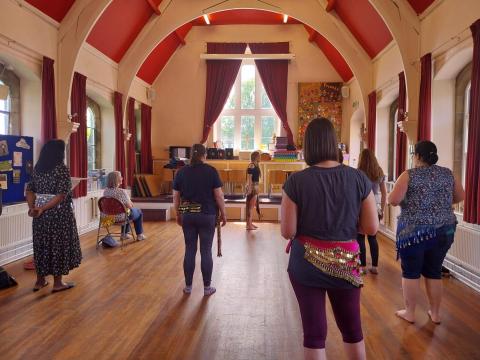 Women dancing in a hall