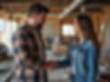 image of man wearing flannel and brown hair and woman in jeans with brown hair shaking han