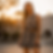 Woman in floral lace two-piece set at sunset.