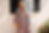 Woman in patterned womenswear by b2b apparel sourcing agency.