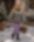Young girl in plaid jacket and purple skirt in snow