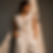 Woman in white eyelet lace vest and trousers