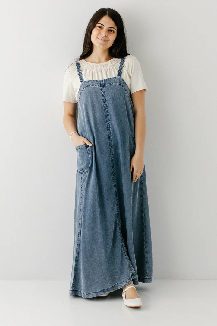 a woman wearing a denim spaghetti strap dress from The Main Street Exchange