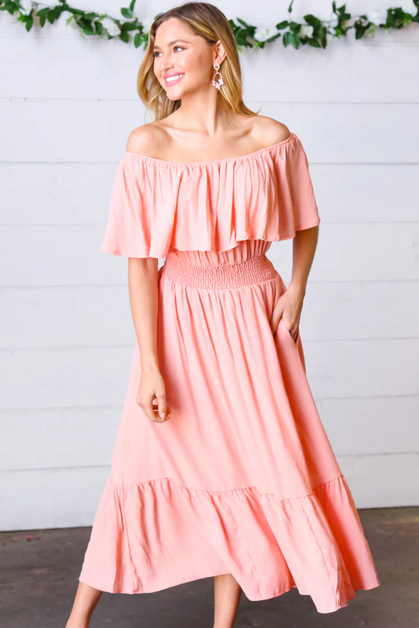a woman wearing off the shoulder coral dress from modest pop