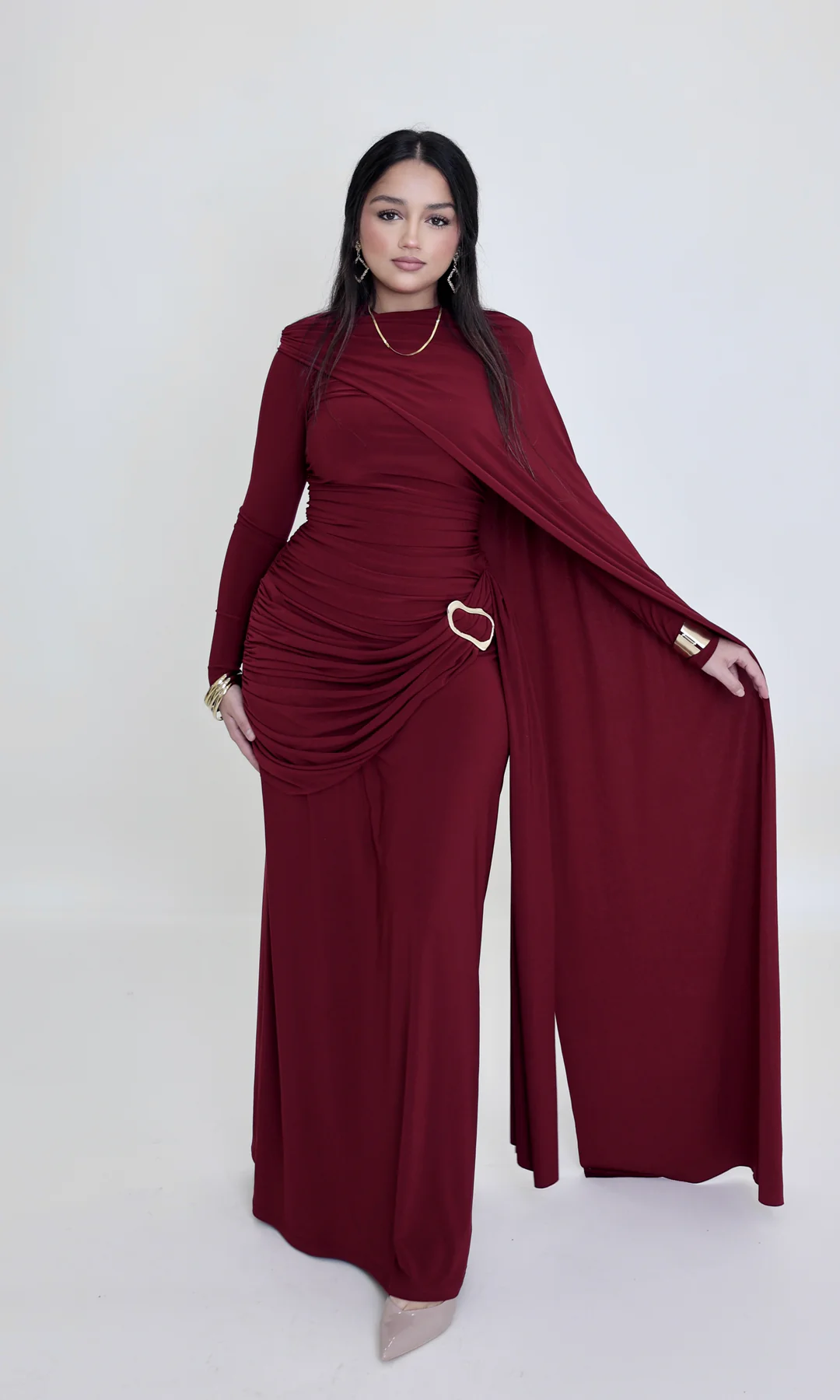 a woman wearing dahlia maxi by modest barbie