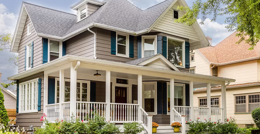 Two-story gray house with white trim and a large front porch.