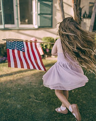 Girl Waving US Flag