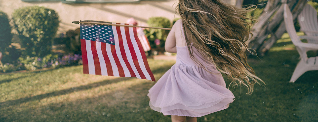 Girl Waving US Flag