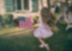 little girl waving American flag