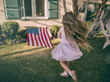 Girl Waving US Flag