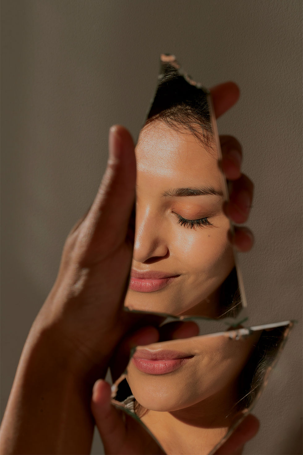 Touch f Glow Skincare Home Page Image with a woman's reflection through the glass
