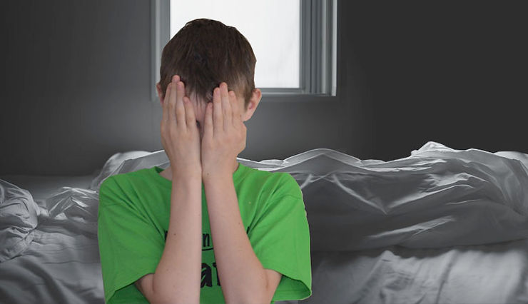 boy covering face