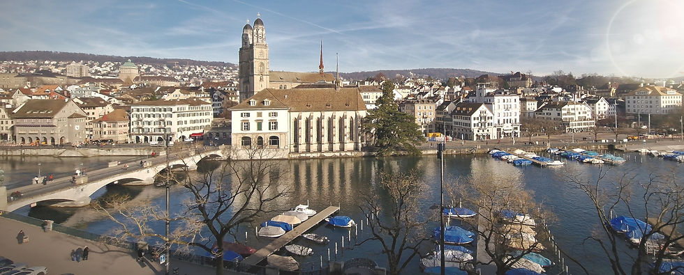 view across the River Limmat overlooking the Grossmunster Church in Zurich