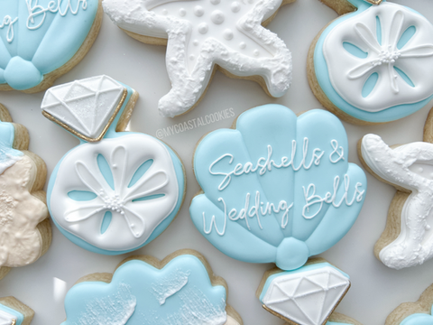 Close-up of Seashells & Wedding Bells bachelorette cookie featuring seashell and engagement ring designs