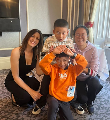 Laura Windsor having her photo taken with a family after afternoon tea etiquette
