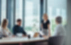 Happy woman leading business meeting