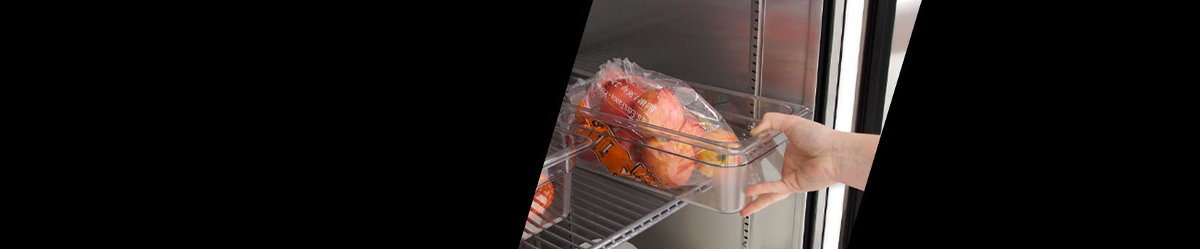 Hand pulling items out of a refrigerator