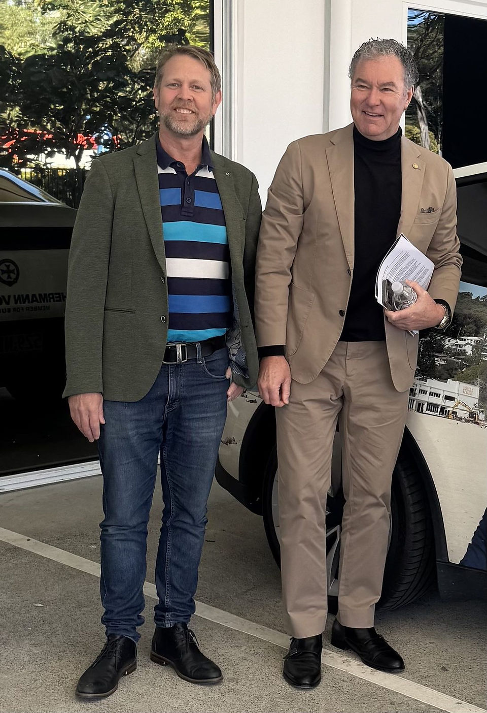 	Two guests photographed outside the entrance to Chrysaor Studios in Varsity Lakes, Gold Coast.