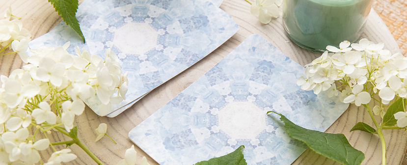 Deck with homemade divination Angel cards on wood table with hydrangea flower for decorati