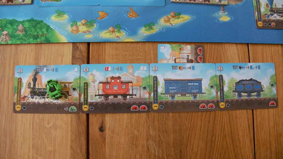 A level two Engine with a green passenger attached to a number 8 Caboose, a level 1 Boxcar and a level 1 Hopper