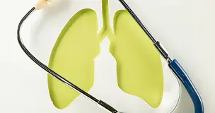 Creative medical concept of lung health with a paper cutout of lungs and a stethoscope, symbolizing respiratory care