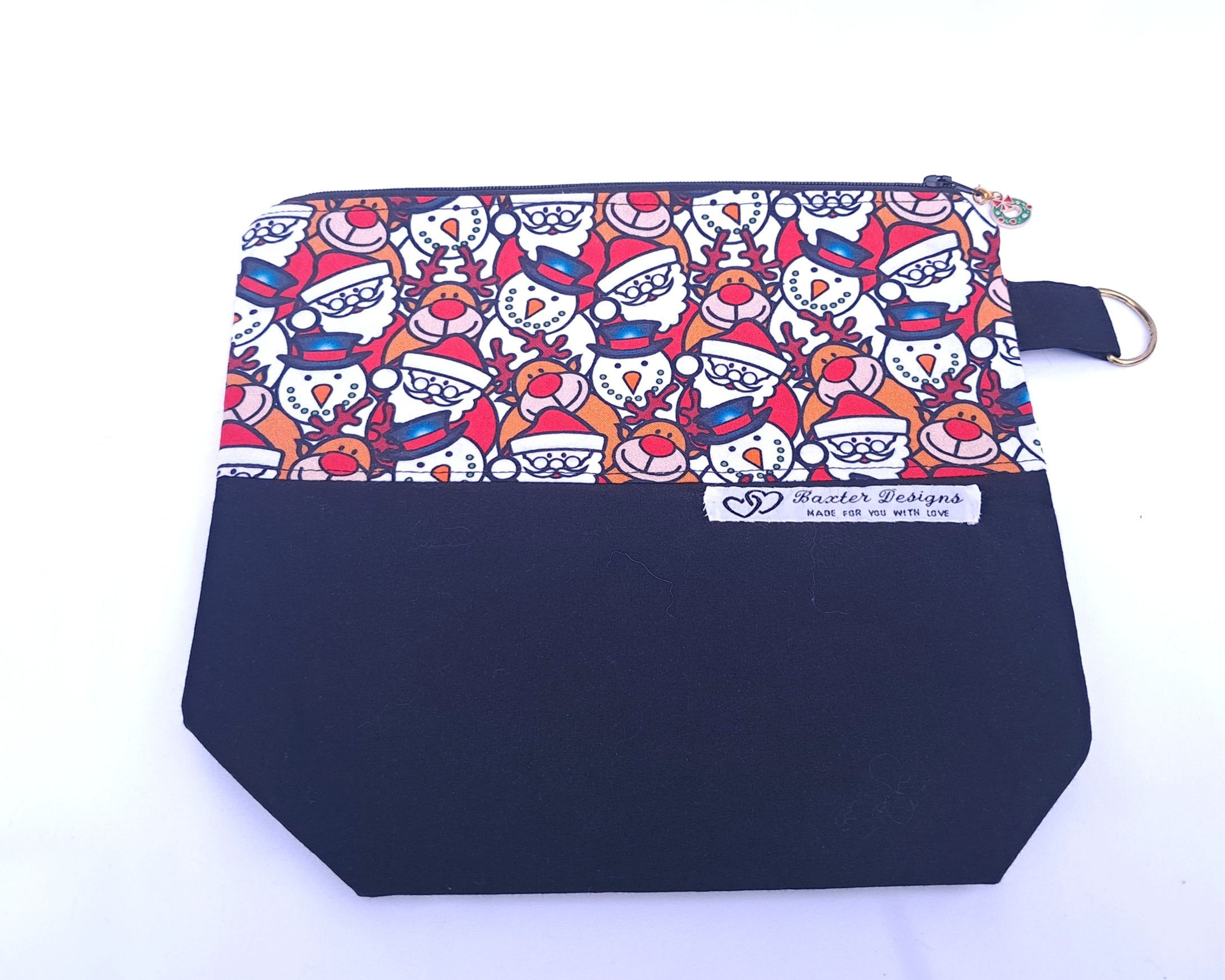 23x20cm bag for small knitting projects. santa, snowman and reindeer fabric top half black fabric bottom half.