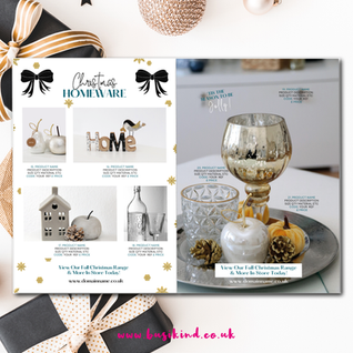 Our 'White Christmas' Catalogue With Scattered Golden Snowflake Design On White Background With Black Bow Detail.  Black & Pine Green Font Colours. Mini Planted Christmas Tree In A White Pot On Front And Back Covers.