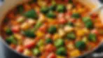 Close-up view of a pot simmering with a colorful vegetable stew