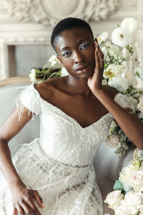 Romantic wedding dress with feather accents