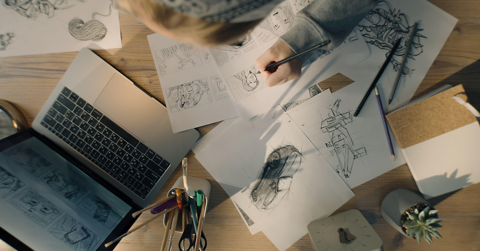 A 3D designer creates animation and works remotely from home on a big PC screen with professional software for modelling and design.