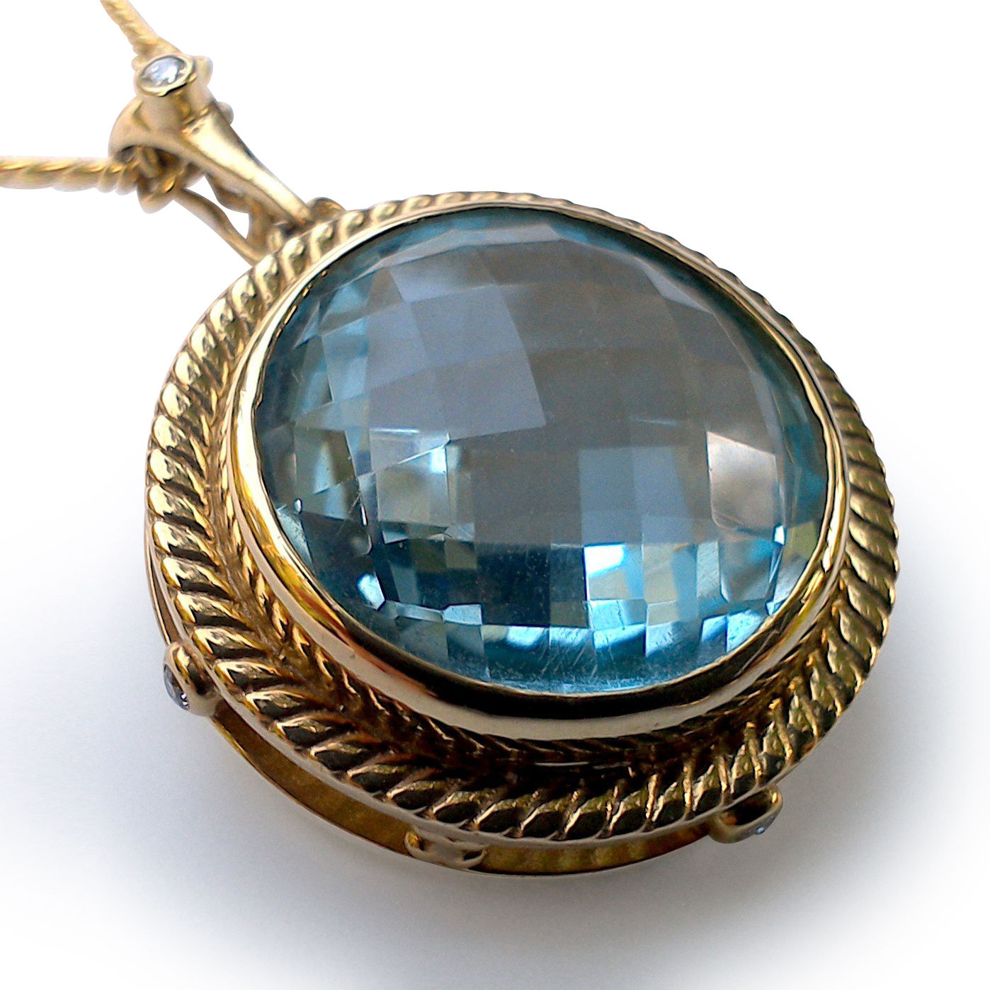 Large blue topaz and diamond pendant with enhancer bail. Also a brooch.