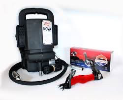 Eye-level view of a professional shearing machine with adjustable blades on a wooden table