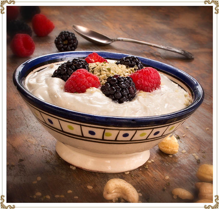 Hemp yogurt in a bowl with blueberries and mulberries