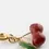 Miniature : Détail du charm Nach Cerises en porcelaine rouge et laiton doré