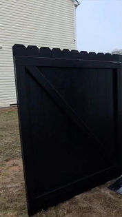 Black fence painting result in Fairburn, GA — gate and panel detail