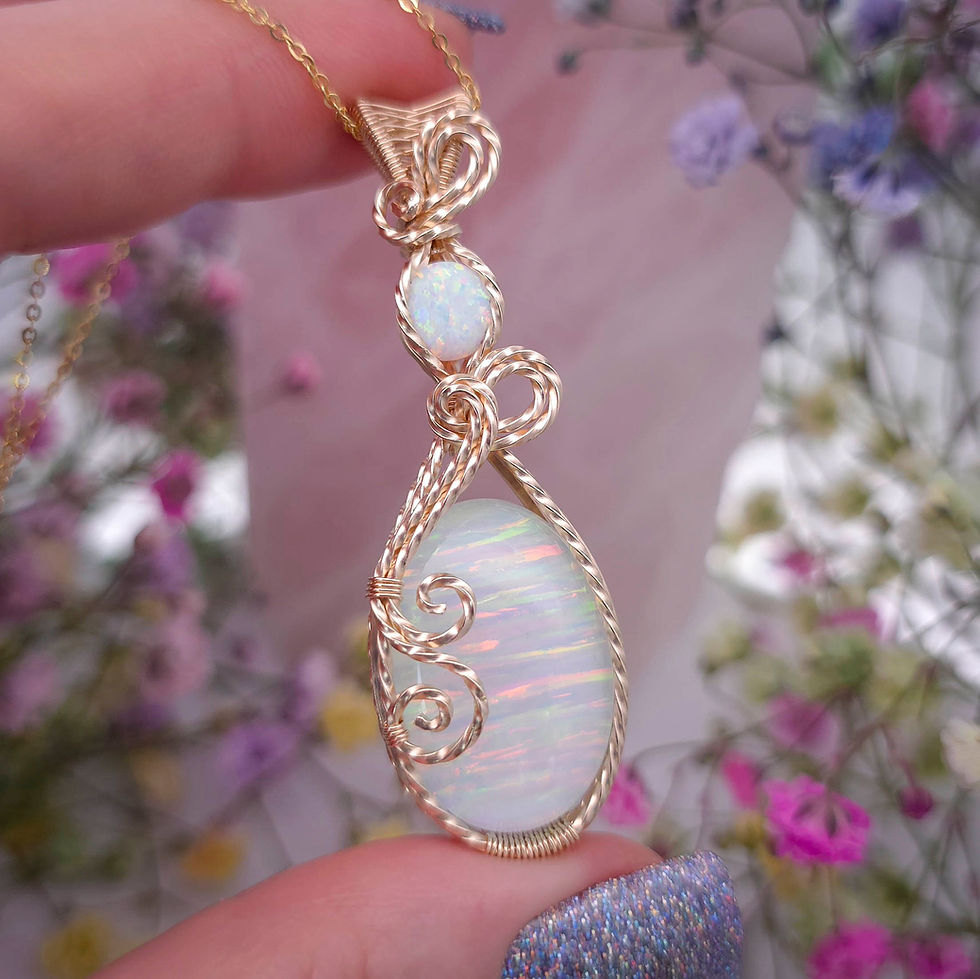 Thumbnail: Lab Grown White Opal Pendant in a Twisted, Woven, and Swirly 14k Gold Frame