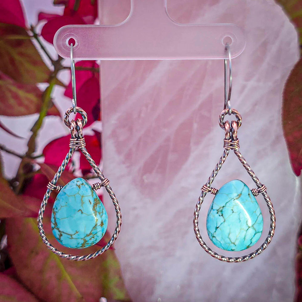 Thumbnail: Turquoise Howlite Teardrop Earrings Hanging in Twisted Copper Frames