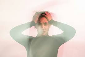 High-functioning anxiety symptoms in a woman who appears calm but feels overwhelmed internally