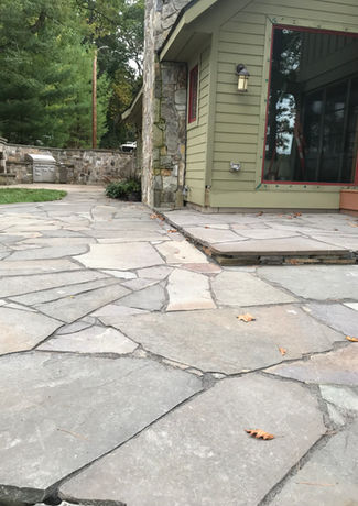 cabin patio out of natural stone, natural hardscapes minnesota