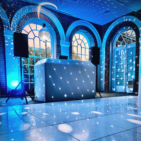 The Retreat at Elcot Park – Elegant DJ setup with ambient lighting for a relaxed corporate event at The Retreat at Elcot Park.