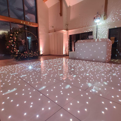 White Starlit Dancefloor and DJ Booth at Wedding for classic elegant look