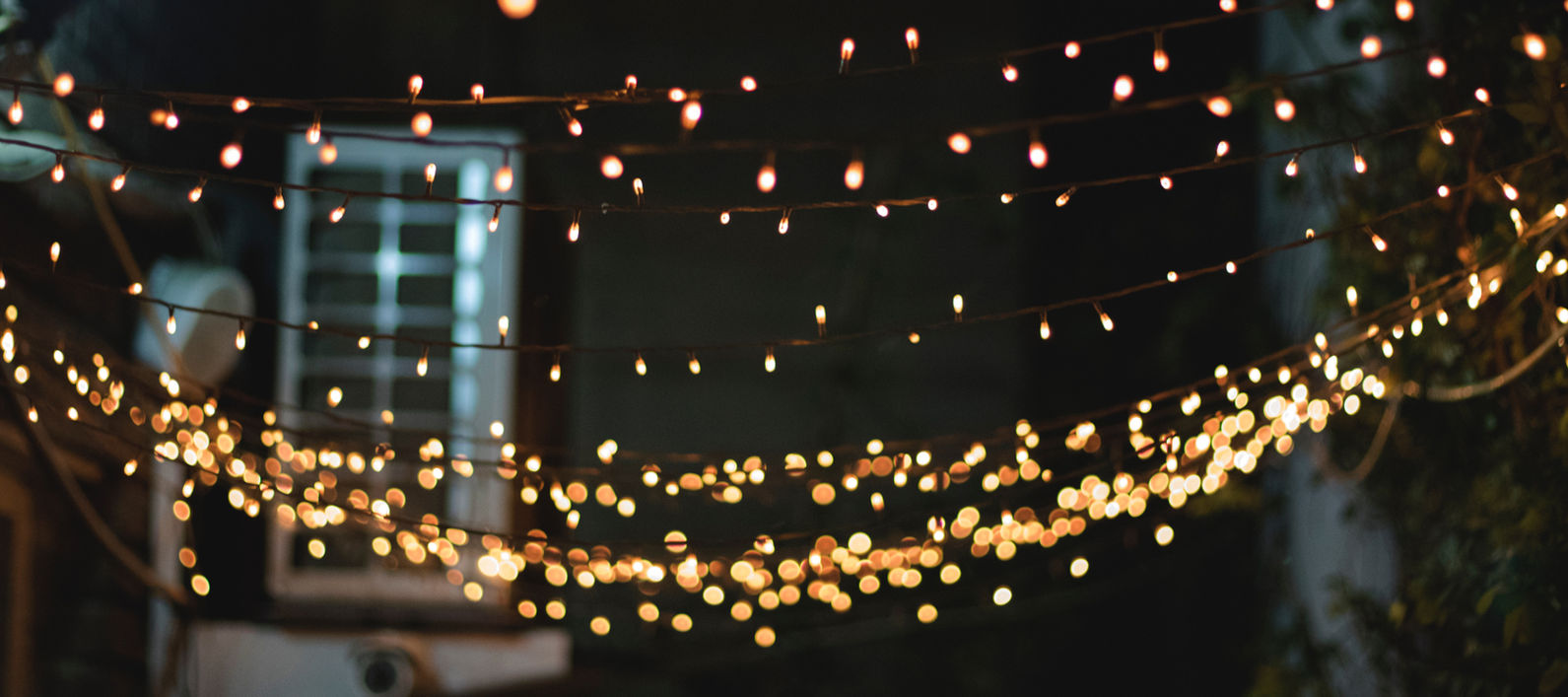Rustic barn decorated with fairy lights for Oxfordshire wedding