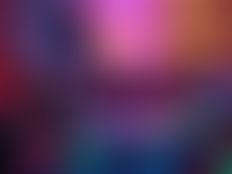 DJ wearing a light jacket mixes music on a console with colorful lights, in a dimly lit room with blurred people and warm ambient lighting.