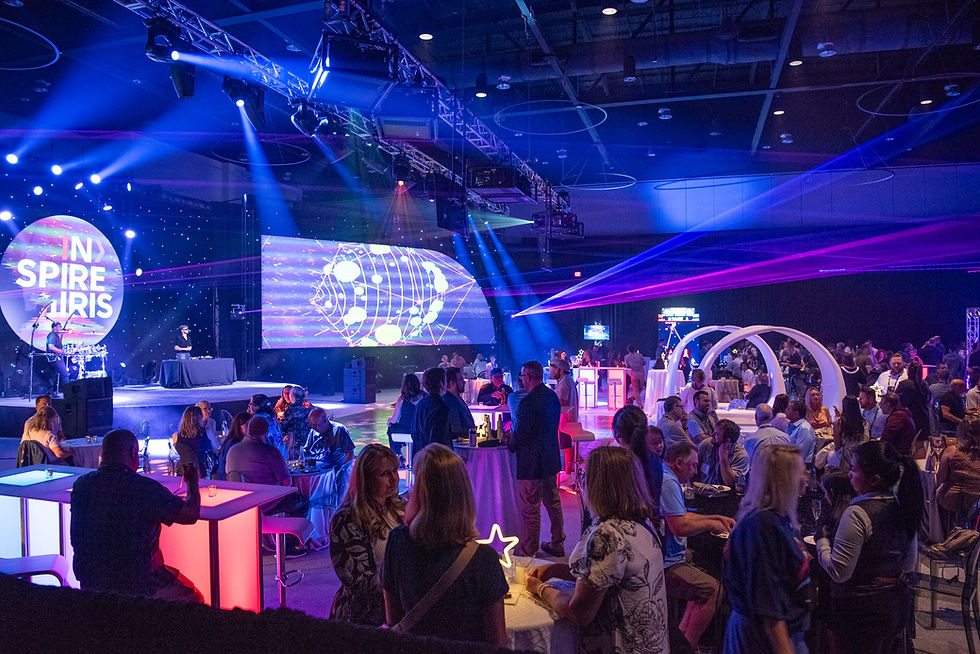 Professional live event production with stage lighting, technical crew, and audience experience management