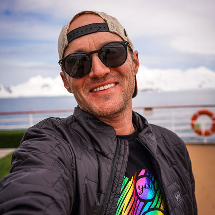 Travel blogger appearing as a guest on a podcast discussing solo travel and seven continents