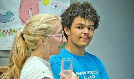 Photo of teenager and leader chatting at youth group