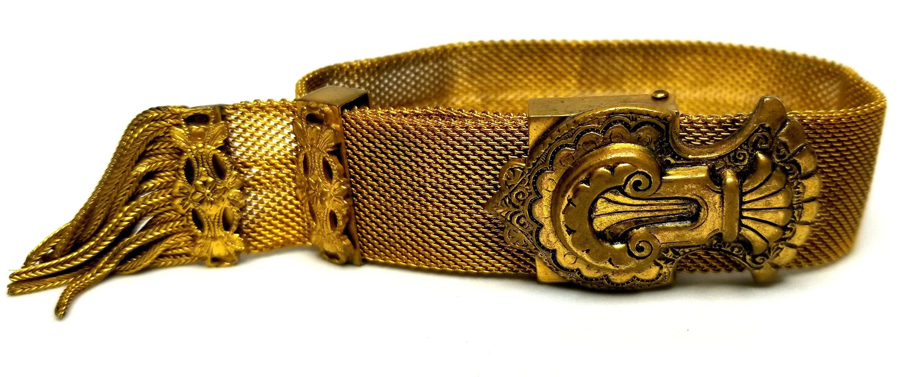 Designer by provenance, bracelet, adjustable gold tone mesh, ornate buckle.